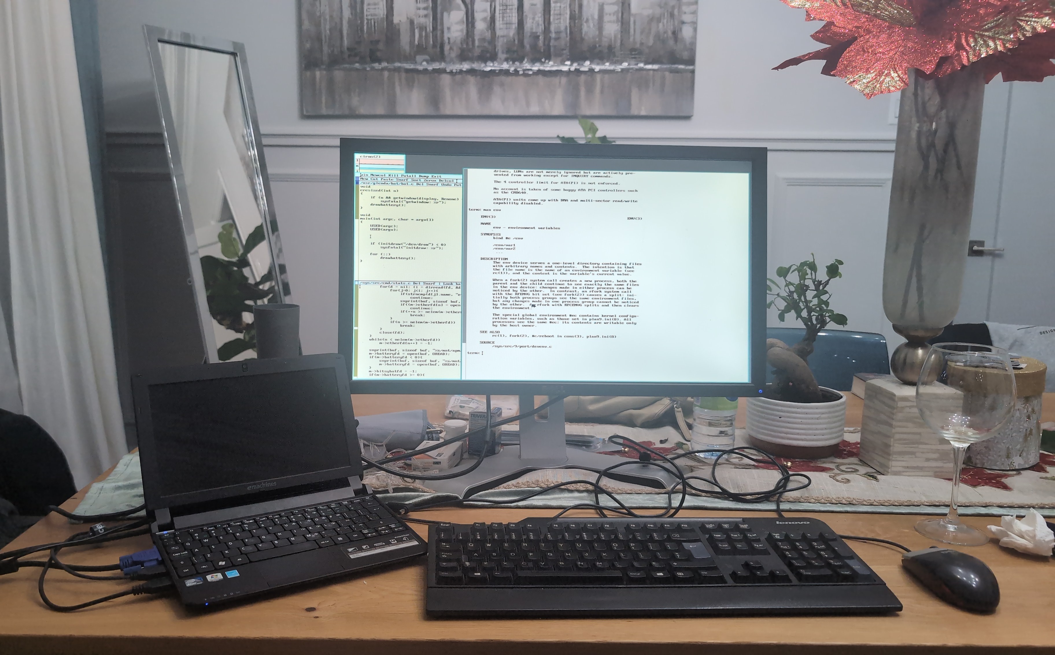 9front running on my emachines laptop next to a 24in monitor